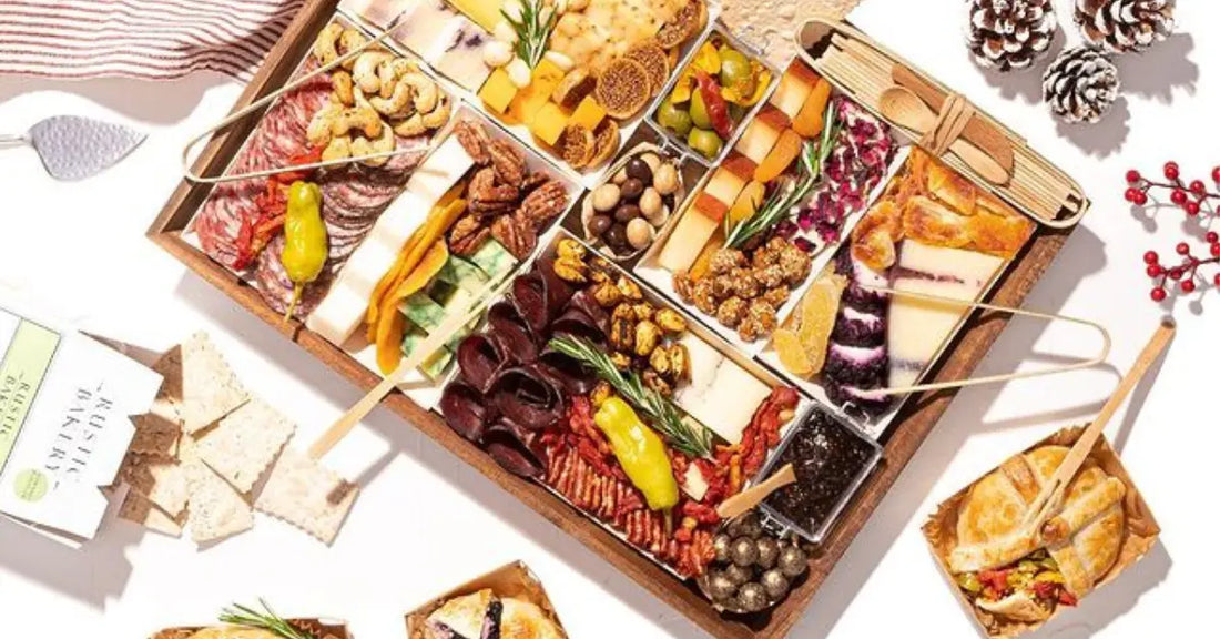 Gourmet charcuterie board with cheeses, nuts, dried fruits, meats, and crackers, arranged on a festive white table