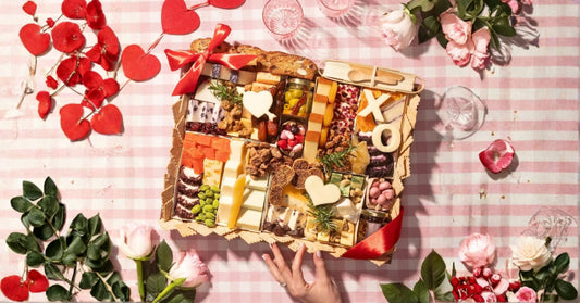 Charcuterie board for two works great in the long, narrow tray format: a balanced mix of 2–3 cheeses, 2 meats, crackers, something sweet, and one spread—perfect for sharing.