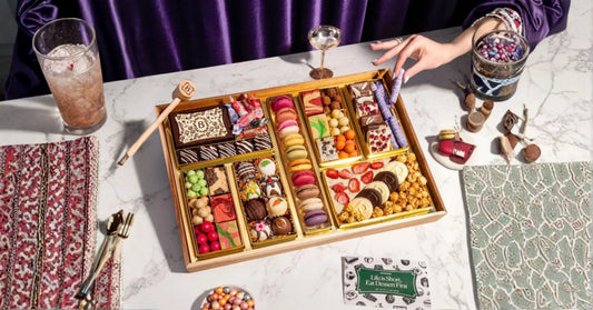 creative dessert board themes displayed with mixed confections, chocolate bark, macarons, and party-ready sweets