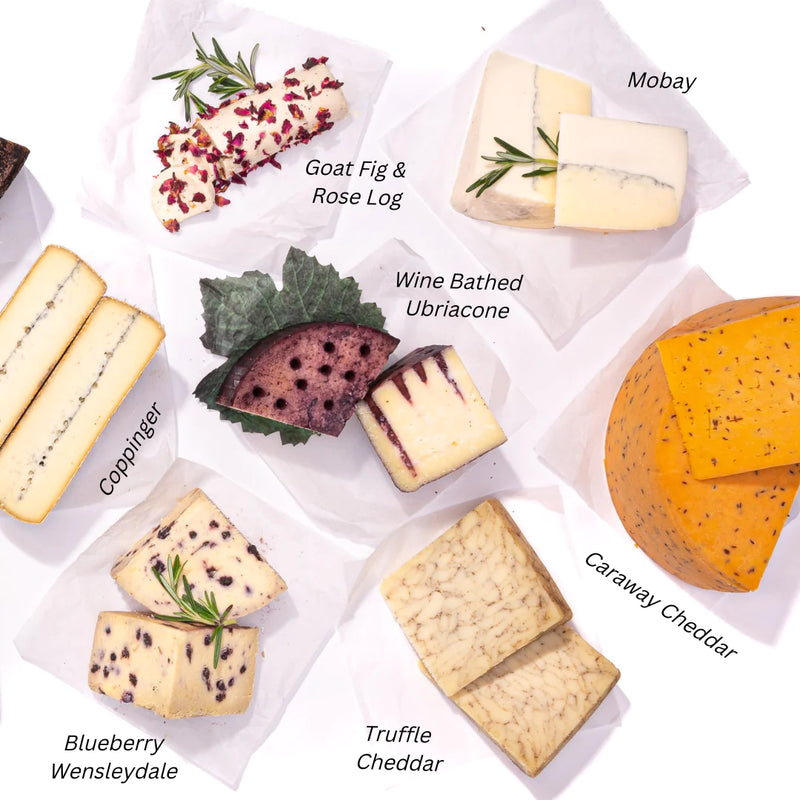 selection of unique cheeses for a charcuterie board, featuring Blueberry Wensleydale, Mobay, Truffle Cheddar, &  Coppinger