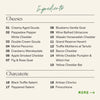An ingredients list graphic on a warm beige background, with the heading 'Ingredients' in teal script. Under the 'Cheeses' section are numbered cheese options such as Creamy Aged Gouda, Peppadew Pepper White Cheddar, Double Cream Gouda, Merlot Pecorino, Apple Smoked Cheddar, Fig & Rose Goat, Blueberry Vanilla Goat, Wine Bathed Ubriacone, Wasabi Horseradish Cheddar, Grand Reserve Havarti, Truffle Moliterno al Tartufo, White Cheddar Pumpkin & Witch Hat, and Yellow Cheddar Bat.
