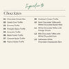 An ingredient list for the Large Halloween Boarderie Dessert Board detailing the chocolates included like the caramel apple truffle and the Halloween white chocolate cheesecake bark