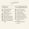 A clean ingredient list graphic for the Boarderie Happy Holidays All Cheese Board on a light warm beige background, with the heading 'Ingredients' at the top and two columns listing cheeses and accompaniments in black text.