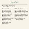 A beige ingredients list titled 'Ingredients' and 'Accompaniments' for the Boarderie Cheese & FALLcuterie Board with food pairings in two columns, including cherries, dates, apricots, ginger, butter pecans, cashews, almonds, mango slices, and crackers.