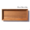 Empty wooden serving tray measuring 17 inches by 7.5 inches by 1.5 inches on a white background