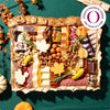 Thanksgiving charcuterie board with Oprah's favorite thing award badge, featuring leaf-shaped cheese cutouts, cured meats, nuts, pickled vegetables, and autumn garnishes on green background.