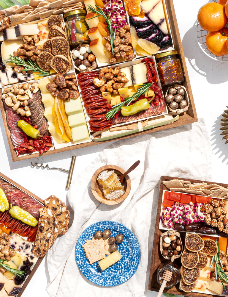 Artisan cheese, charcuterie, and gourmet dessert boards arranged for a luxury grazing spread, delivered fresh nationwide with free overnight shipping.