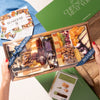 Hands holding a gourmet charcuterie board gift box with cheeses, nuts, and dried fruits, wrapped with a branded ribbon.