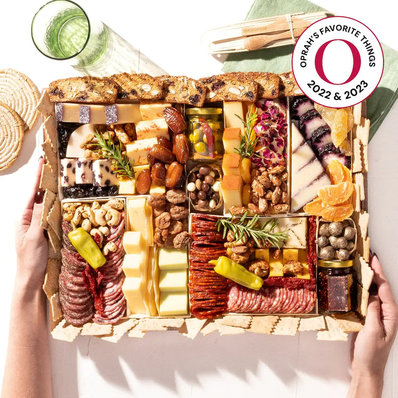 Oprah's Favorite Things 2022 & 2023 charcuterie board filled with cheeses, meats, nuts, dried fruits, & gourmet snacks