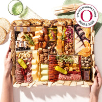 Oprah's Favorite Things 2022 & 2023 charcuterie board filled with cheeses, meats, nuts, dried fruits, & gourmet snacks