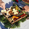 Christmas charcuterie board being enjoyed as a festive appetizer for a holiday celebration