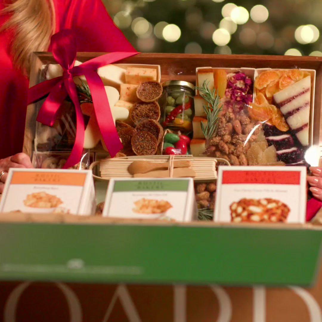 Holiday charcuterie board corporate gifts being delivered, unboxed and enjoyed for hosting and entertaining in various sizes with assortments of cheeses, meats, nuts, fruits, crackers and more in beautiful settings 