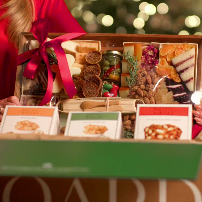 Holiday charcuterie board corporate gifts being delivered, unboxed and enjoyed for hosting and entertaining in various sizes with assortments of cheeses, meats, nuts, fruits, crackers and more in beautiful settings 