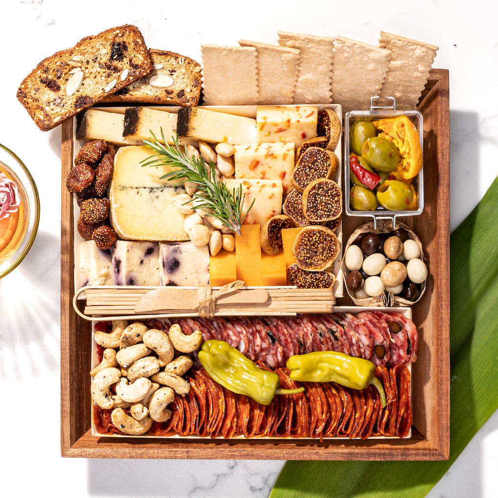 https://boarderie.com/cdn/shop/files/small-cheese-charcuterie-board-gift-shipped-nationwide_1600x.jpg?v=1701023016