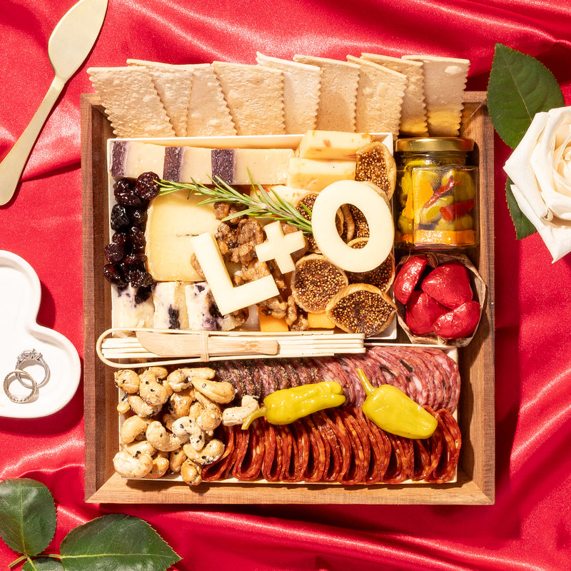 small engagement anniversary wedding charcuterie board with cheese cut outs of L + O