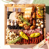 Small cheese and charcuterie board with assorted meats, cheeses, nuts, dried fruits, and olives, artfully arranged.