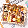 teacher-appreciation charcuterie board with cheese, meats, nuts, an "A+" cutout, & apple-shaped cheese on a checkered cloth